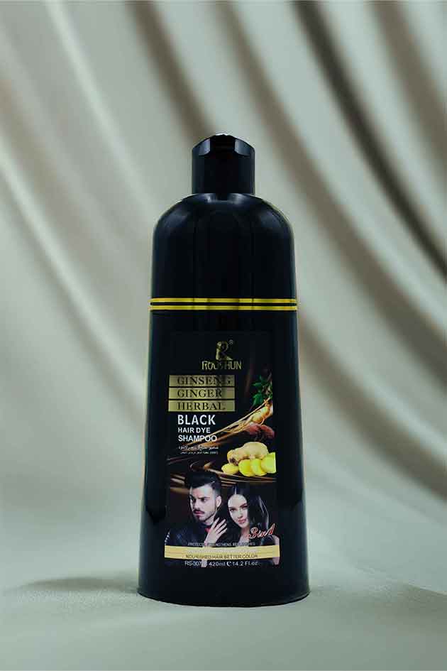 Black shampoo bottle with label on a beige background