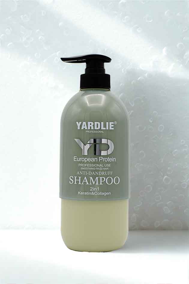 How to use steps—apply, massage, rinse Yardlie Keratin & Collagen Smoothing Anti-Frizz Shampoo. Yardlie shampoo bottle with pump on a light background