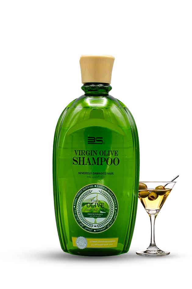 Virgin Olive Shampoo bottle with olive oil glass – natural hair nourishment and repair product. Green shampoo bottle with a gold cap on a white background, next to a glass of olive oil.