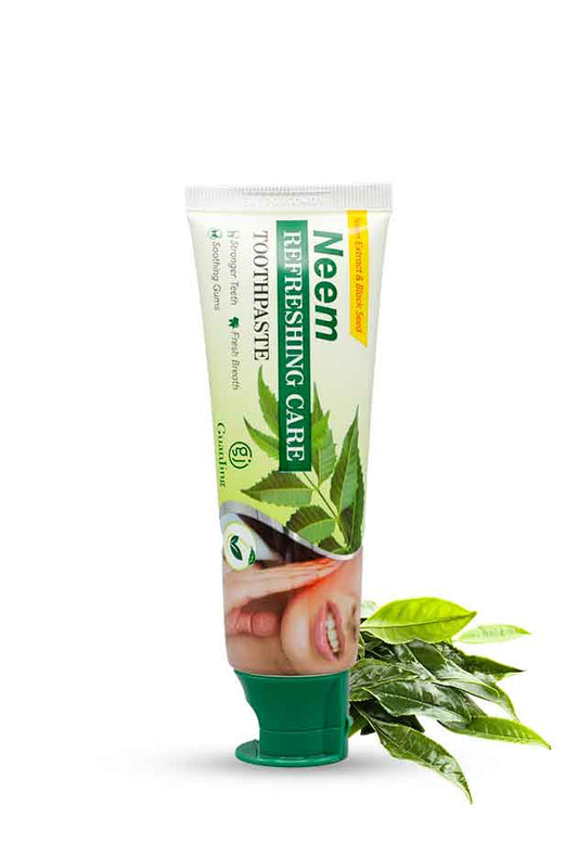 Neem Refreshing Care Toothpaste tube with neem leaves – herbal whitening and gum care toothpaste. Neem toothpaste tube with green leaves on a white background
