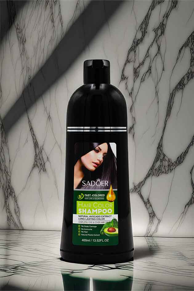 Natural Black Hair Dye Shampoo for Men and Women by Yardlie. Black shampoo bottle with a label featuring a woman's face on a marble background