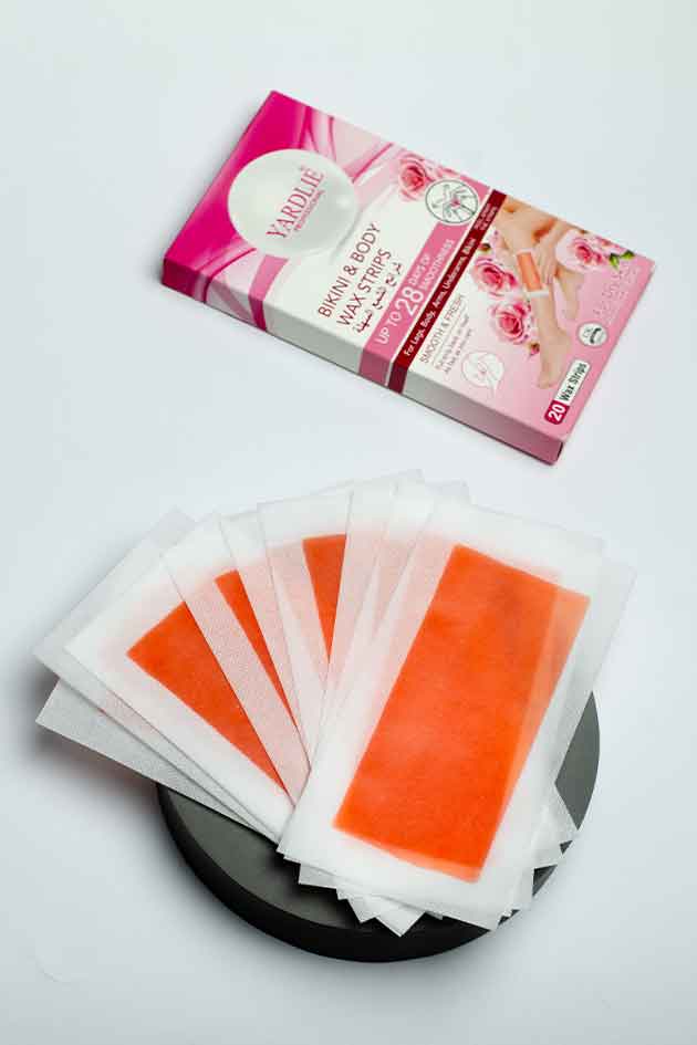 Yardlie Bikini Body Wax Strips Rose Extract pack with 20 hair removal strips, Pack of undergarment care sheets with packaging on a white background