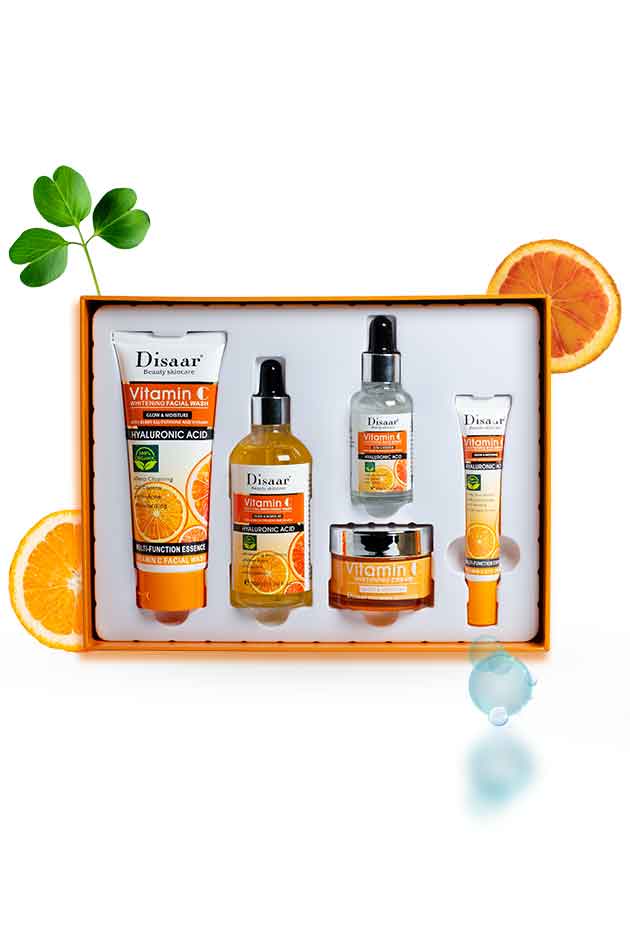 Disaar Vitamin C 5-in-1 Brightening & Hydrating Skincare Kit with Hyaluronic Acid – facial wash, toner, serum, cream, and eye cream set.. Set of skincare products with orange slices and a plant leaf on a white background