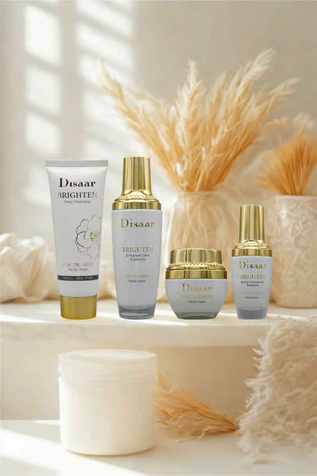 Disaar Niacinamide 4-in-1 Brighten Skincare Kit – facial wash, lotion, cream, and serum for glowing hydrated skin. Set of Disaar skincare products on a white surface with decorative elements.