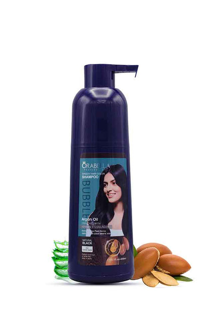 Orabella Professional Speedy Hair Color Shampoo Natural Black 400ml bottle – instant grey coverage and salon-like results at home. Orabella shampoo bottle with auburn hair on label, surrounded by aloe vera leaves and argan seeds on a white background