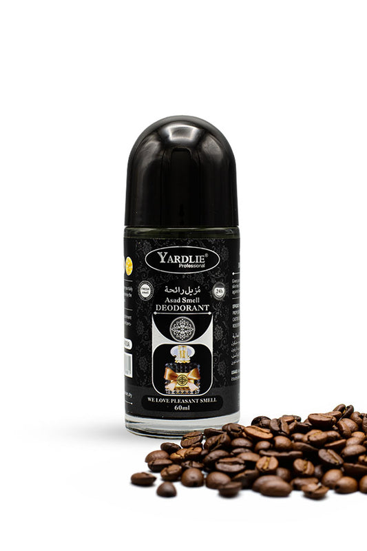 Yardlie Bold Fragrance Roll On Deodorant 60ml bottle for 24 hour freshness,
A Yardlie roll-on deodorant bottle with a black cap and black label, placed on a white background with scattered coffee beans in the foreground.