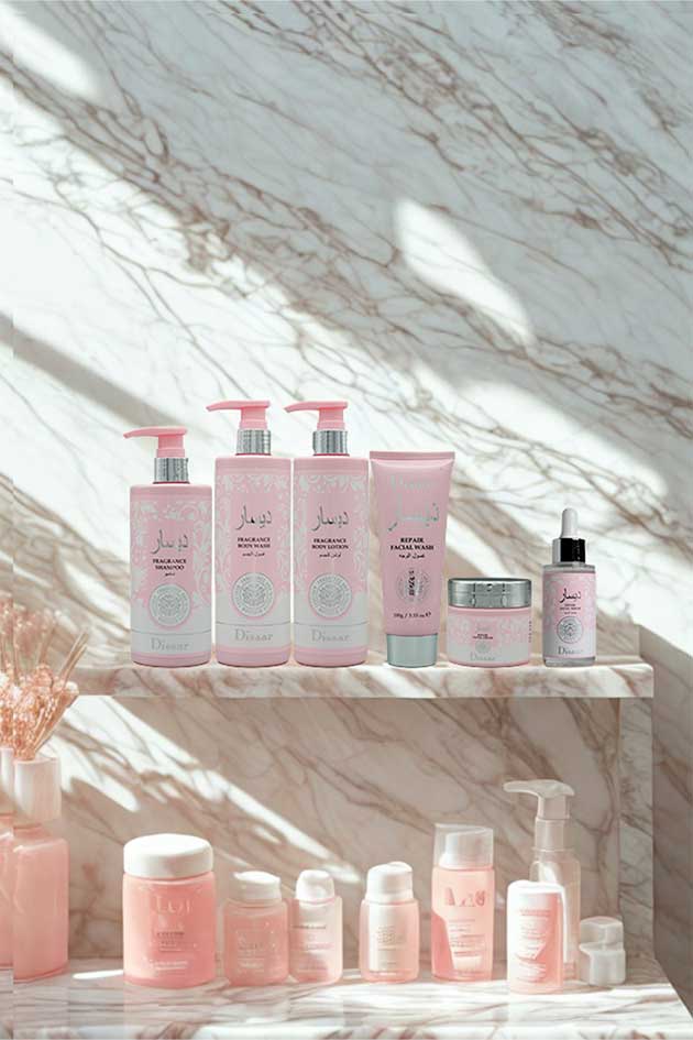 Disaar 6-in-1 skincare and body care combo set – fragrance shampoo, body wash, lotion, and repair facial products. Collection of pink skincare products on a marble surface with sunlight casting shadows.