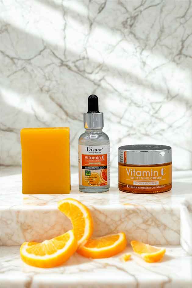 Disaar 3 in 1 Vitamin C Beauty Kit with Whitening Cream, Face Serum and Vitamin C Soap for Glowing Skin. Skincare products with oranges on a marble surface