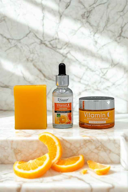 Disaar 3 in 1 Vitamin C Beauty Kit with Whitening Cream, Face Serum and Vitamin C Soap for Glowing Skin. Skincare products with oranges on a marble surface