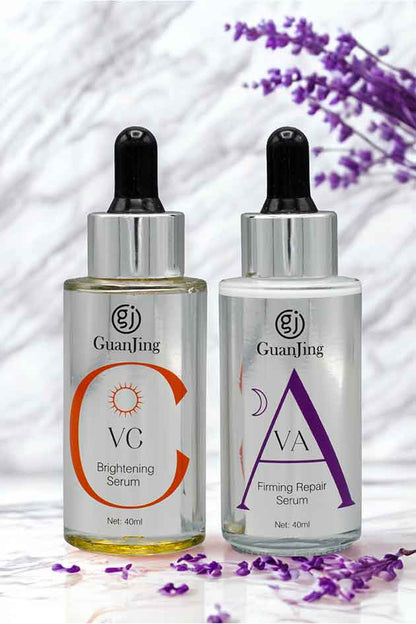 Two skincare serum bottles with droppers on a white background with lavender flowers.