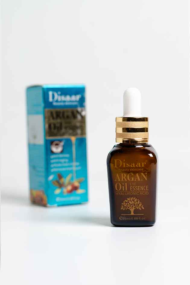 Disaar Argan Oil Essence bottle with box – hydrating facial serum with hyaluronic acid. Disaar Argan Oil Essence bottle with dropper and packaging on a white background