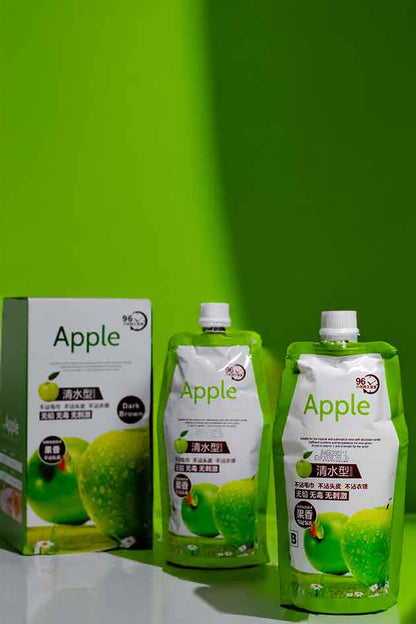 Green Apple juice packaging with a box on a green background
