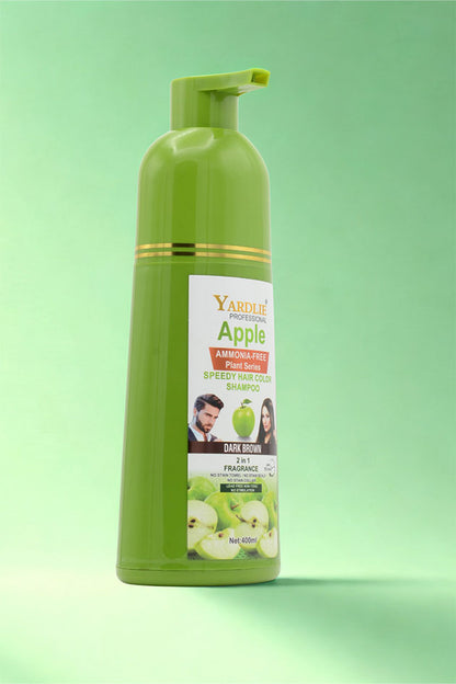Green bottle of Yardlie Apple Shampoo on a green background