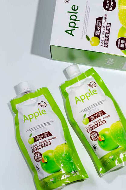 Two green juice packs with 'Apple' branding on a white background