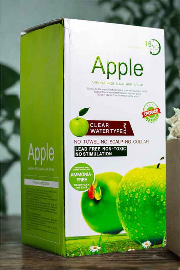 Lead-free non-toxic clear water technology hair color in Natural Black.Box of Apple hair care product with green apple illustration on a blurred background