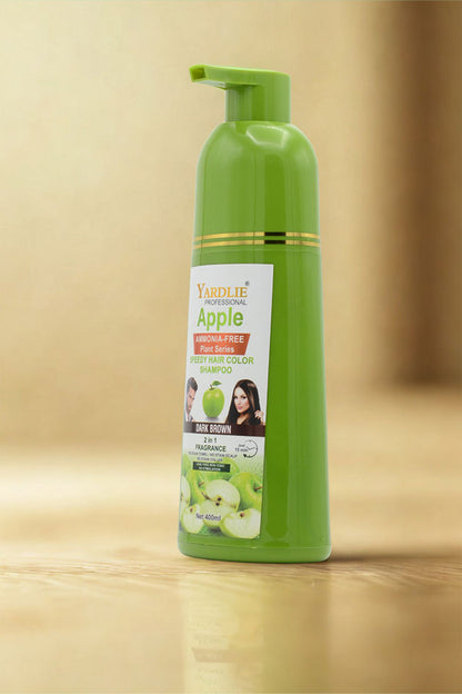 Green shampoo bottle with a label on a beige background