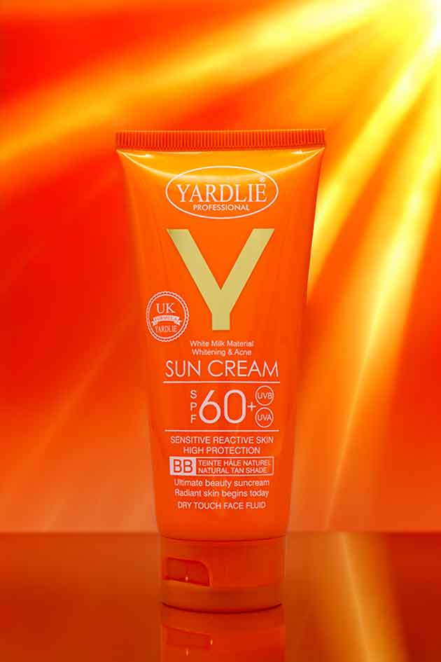 Yardley Professional sun cream tube on a bright orange background
