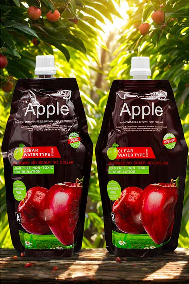 Apple extract hair coloring cream with no towel, no collar stains. Two Apple juice packs with red apples on a natural background