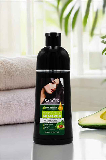 SADOER Hair Color Shampoo Bottle on Black Marble Background – Yardlie.com. Sadoer hair shampoo bottle with avocado on a table