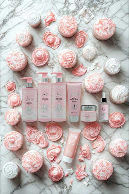 Disaar 6-in-1 skincare and body care combo set – fragrance shampoo, body wash, lotion, and repair facial products. Collection of pink skincare products and floral decorations on a marble surface