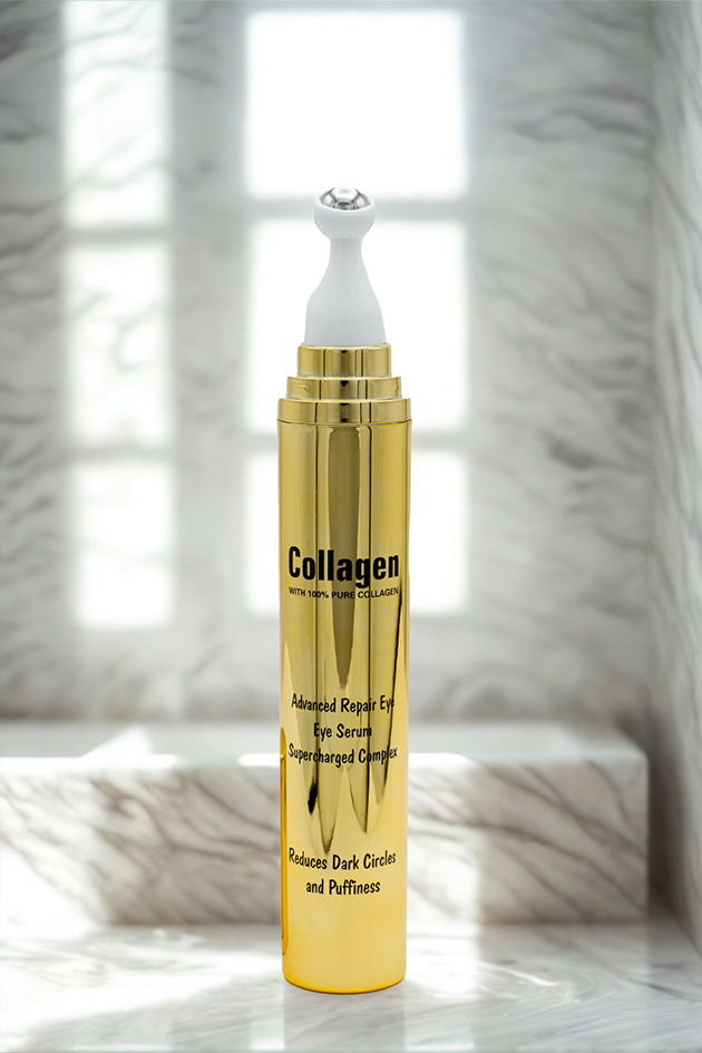 Collagen eye serum with roller on vanity, soft blur pampas background Gold collagen eye serum bottle on a marble surface with a blurred background