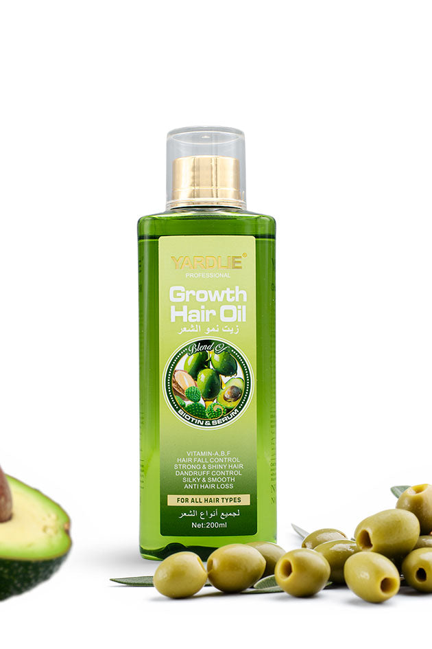 Yardlie Nourishing Hair Oil with argan, olive and avocado 200ml for dry, frizzy hair,
A bottle of Yanluie Anti Dandruff Hair Oil with olive branches, seeds, and olives arranged around it on a white background.
