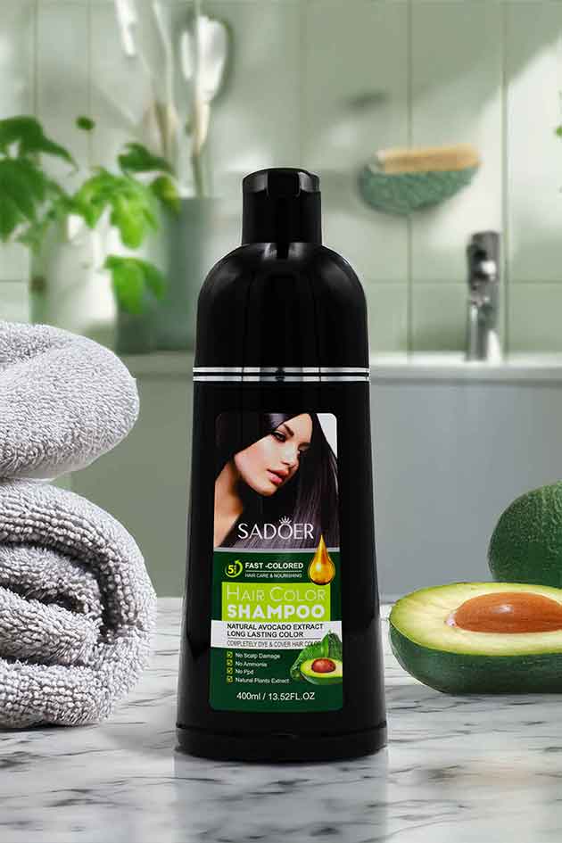SADOER Hair Color Shampoo – No Ammonia, Deep Nourishment with Avocado Oil. Sadoer hair shampoo bottle with avocado on a bathroom counter