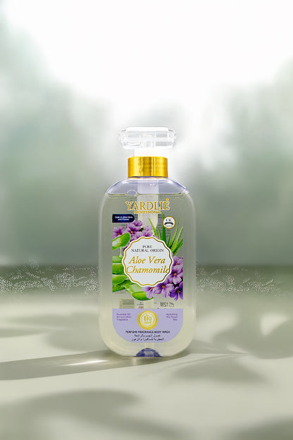 Yardlie Aloe Vera Chamomile Perfume Fragrance Body Wash 500ml bottle for soft, soothed skin.
A bottle of Yarde's Aloe Vera Chamomile hand and foot wash, featuring a clear bottle with a gold cap and a purple and green label, set against a soft-focus green and white background.