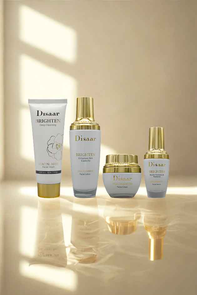 Disaar Niacinamide 4-in-1 Brighten Skincare Kit – facial wash, lotion, cream, and serum for glowing hydrated skin. Set of Disaar skincare products on a reflective surface with a neutral background
