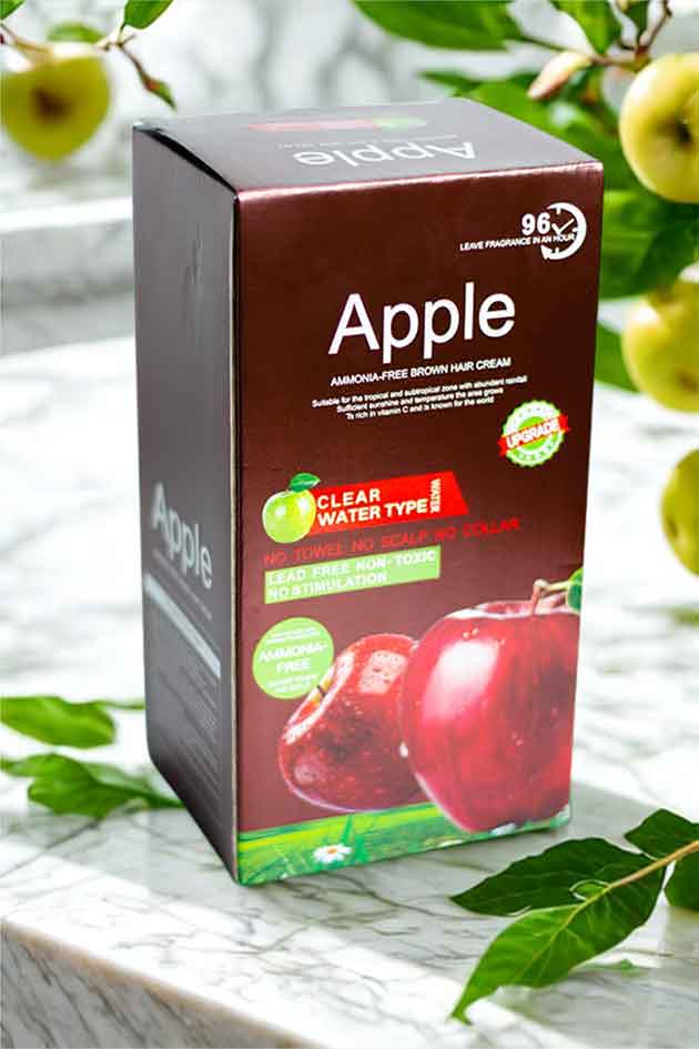 Box of Apple hair cream with apples and leaves in the background