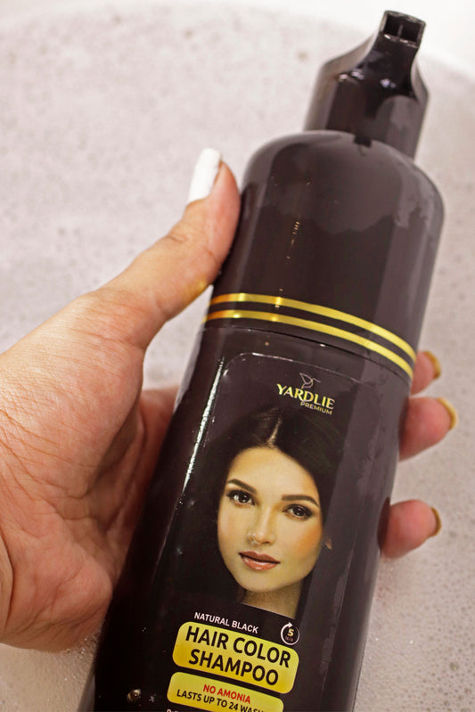 Yardlie Premium Natural Black Hair Color Shampoo 200ml clearance deal without box, gloves included, fresh sealed bottle
A black bottle of Yardlie Premium Black Hair Color Shampoo with a label featuring an image of a woman's face. Additional decorative elements include flowers and leaves around the bottle.