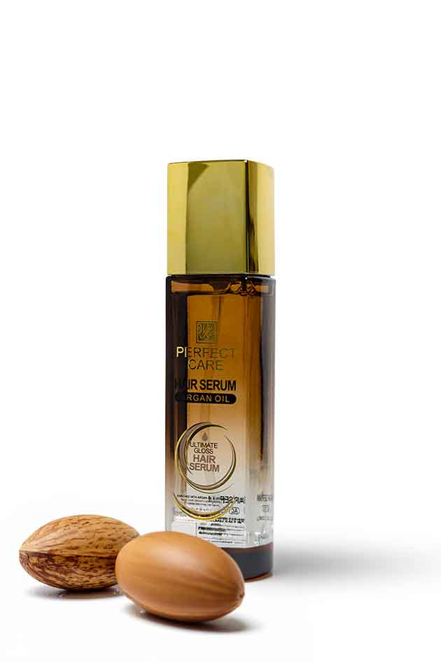 Perfect Care Argan Oil Hair Serum 120ml for frizz control, shine and smoother hair available at Yardlie Pakistan, Hair serum bottle with a gold cap and two nuts on a white background