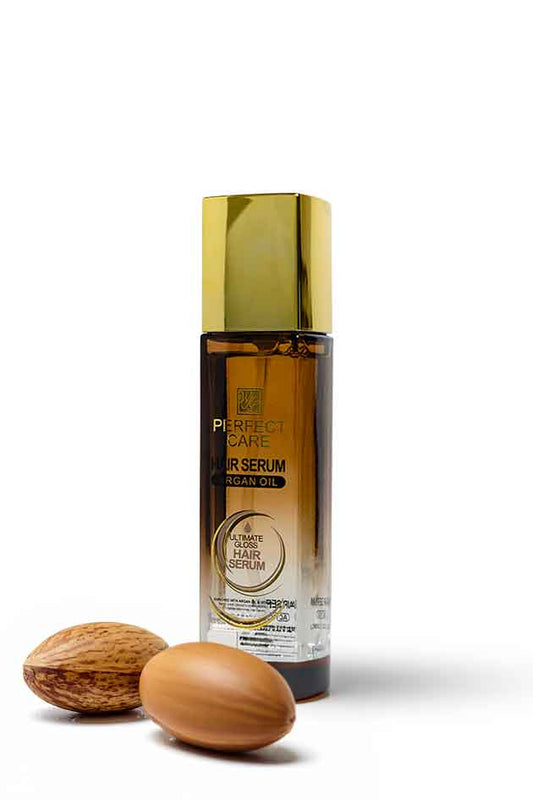 Perfect Care Argan Oil Hair Serum 120ml for frizz control, shine and smoother hair available at Yardlie Pakistan, Hair serum bottle with a gold cap and two nuts on a white background