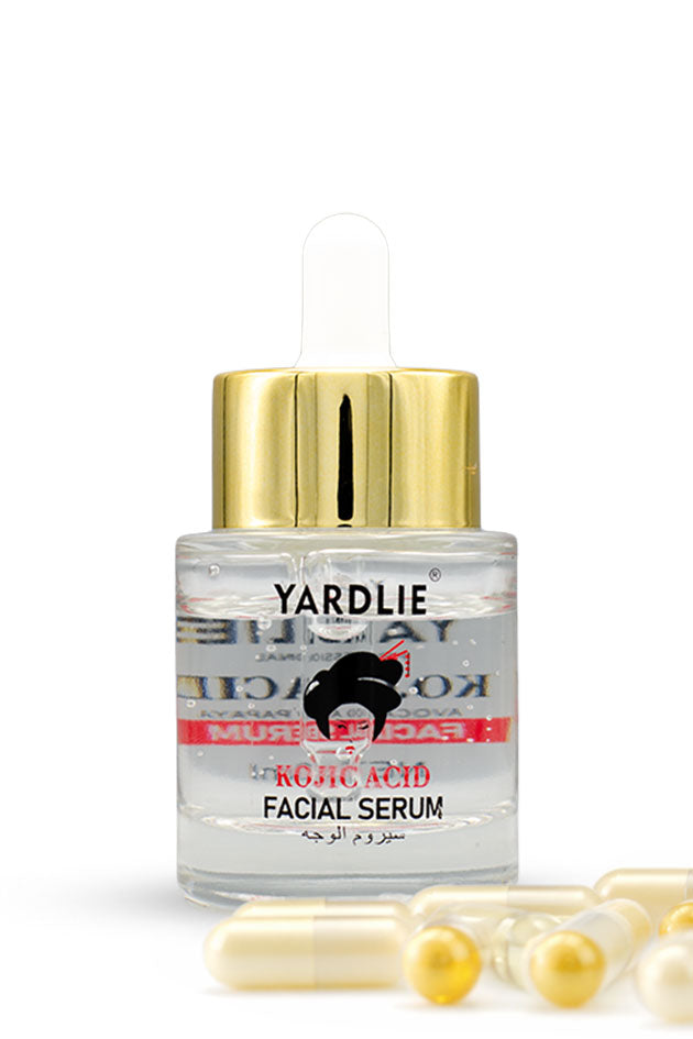 Yardlie Kojic Acid Avocado and Papaya Facial Serum 30ml pack front,
Yardlie Rotic Acid Facial Serum in a clear glass dropper bottle with a gold cap, shown on a white background with several gold capsules in the foreground.