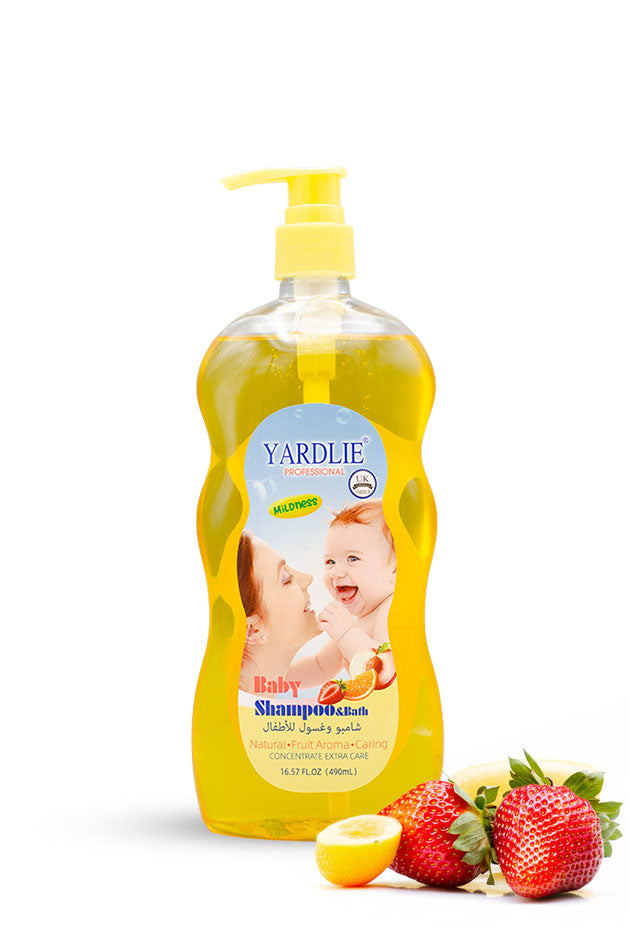 Yardlie tear free baby shampoo and bath 490ml pump bottle,
A bottle of Yardlie Baby Shampoo in a bright yellow liquid with a yellow pump dispenser, shown on a white background with fresh strawberries and a lemon slice as flavor props.