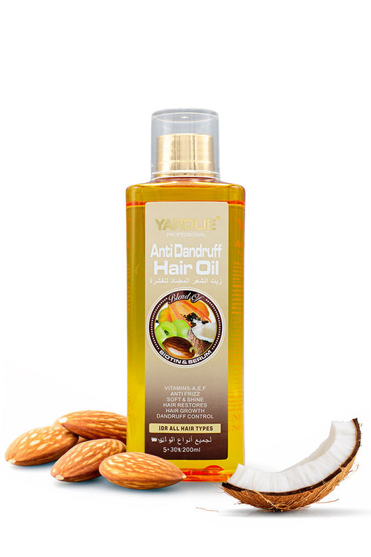 Yardlie Nourishing Hair Oil with Coconut and Papaya 200ml Online in Pakistan,
A bottle of Yardlie Anti Dandruff Hair Oil with a gold cap, displayed on a white background with almonds and a halved coconut at its base.