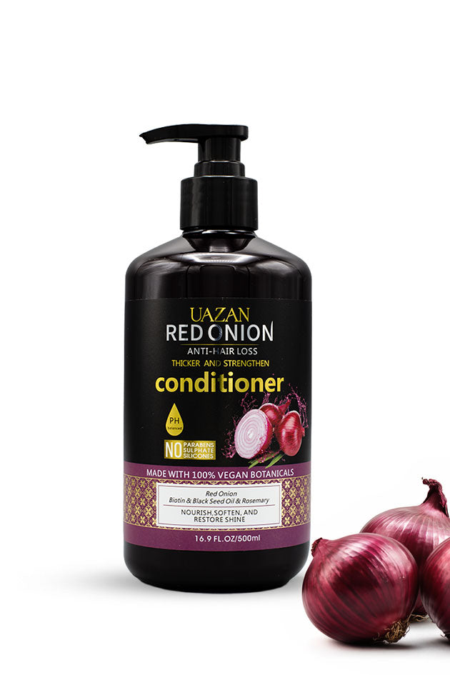 UAZAN Red Onion Strengthening Conditioner 500ml with biotin and rosemary for stronger softer hair,
A bottle of Uazan Red Onion Conditioner with a black pump dispenser, shown next to fresh red onions on a white background.
