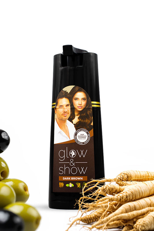 Glow and Show Dark Brown Hair Darkening Shampoo 180ml for men and women, Hair product bottle with a label featuring two people, surrounded by green olives and roots on a white background.