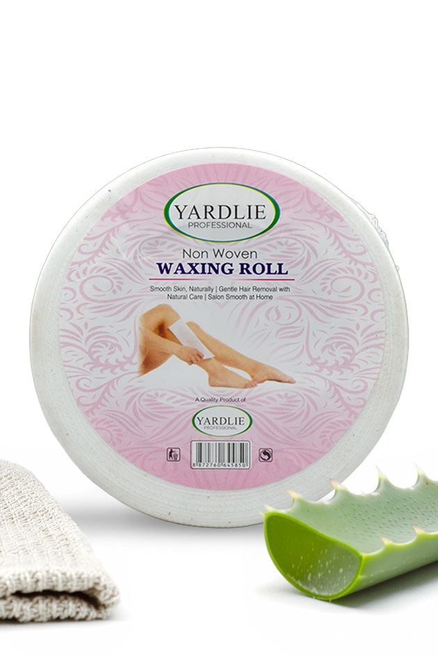 Yardlie Non Woven Waxing Roll for gentle salon smooth hair removal at home in Pakistan
A round tub of Yardlie Professional Non Woven Waxing Roll on a white background, styled with a folded beige towel and a green aloe vera slice. The label is pink and white with a photo of legs receiving a waxing treatment.