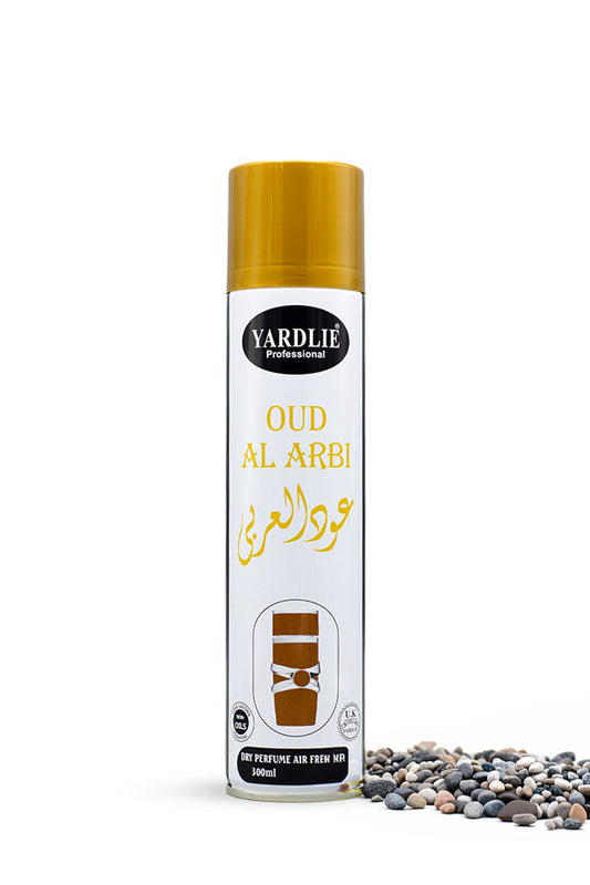 Yardlie Professional Oud Al Arbi Dry Perfume Air Freshener 300ml can,
A 500ml aerosol can of Yardli Professional Oud Al Arbi perfume air freshener, featuring a white body with a gold cap and gold lettering, displayed next to decorative pebbles on a white background.