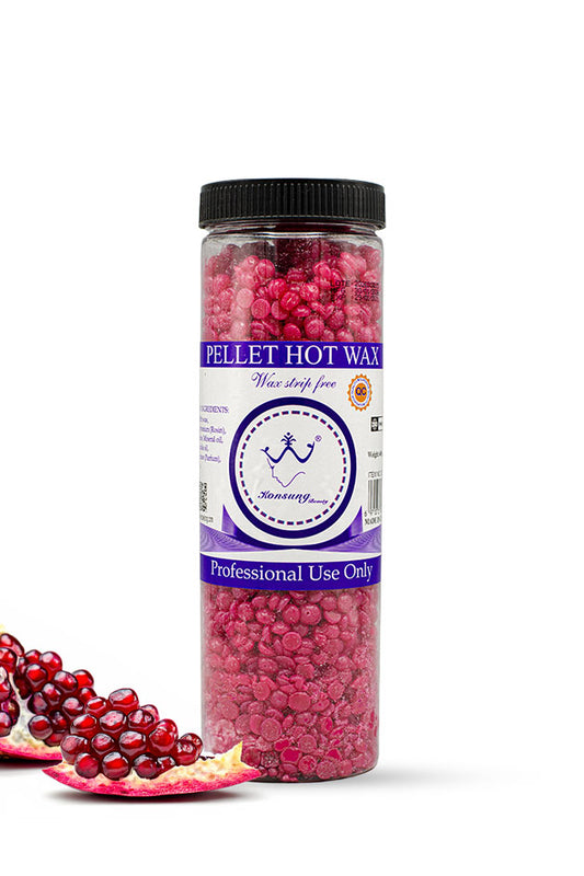 Konsung Beauty Pomegranate Pellet Hot Wax Beans 400g ruby red hard wax for strip free hair removal,
A clear plastic jar of Pellet Hot Wax wax melt pieces with a black lid and a purple/white label, shown on a white background with pomegranate slices and seeds in the lower left.