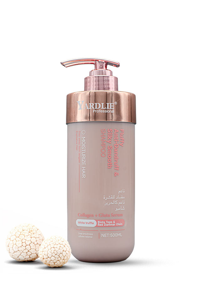 Yardlie Professional Anti-Dandruff Silky Smooth Shampoo with Collagen and White Truffle 500ml pump bottle,
A bottle of Yardlie Professionals Collagen + Cleanse Hair on a white background, styled with three textured white beads on the left. The bottle is a dusty mauve color with a metallic rose gold pump and collar.