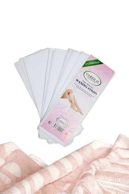 Yardlie Non Woven Waxing Strips student pack for gentle hair removal at home in Pakistan, 
A fan of white disposable waxing strips with a pink and white Vardlie package, shown above a folded pink and white striped fabric on a white background.