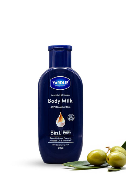 Yardlie Professional Body Milk intensive moisture body lotion 220g bottle for dry to very dry skin,
A bottle of Yardlie Body Milk intensive moisturizer, 220g, in a dark blue bottle with a matching cap. The bottle is shown on a white background with green olives and leaves as decorative props in the bottom right corner.
