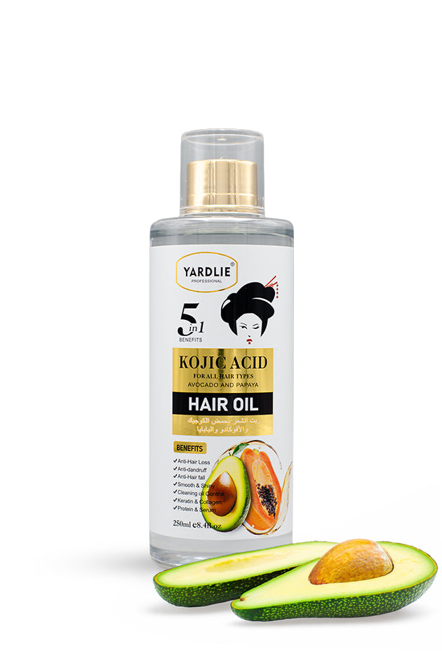 Yardlie Professional Kojic Acid Hair Oil Avocado and Papaya 250ml bottle for all hair types,
A bottle of Yardlie Kojic Acid Hair Oil with a gold cap, shown on a white background with sliced avocado halves in the foreground.